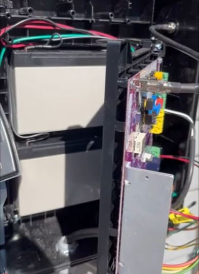 The batteries inside the control box behind the control board